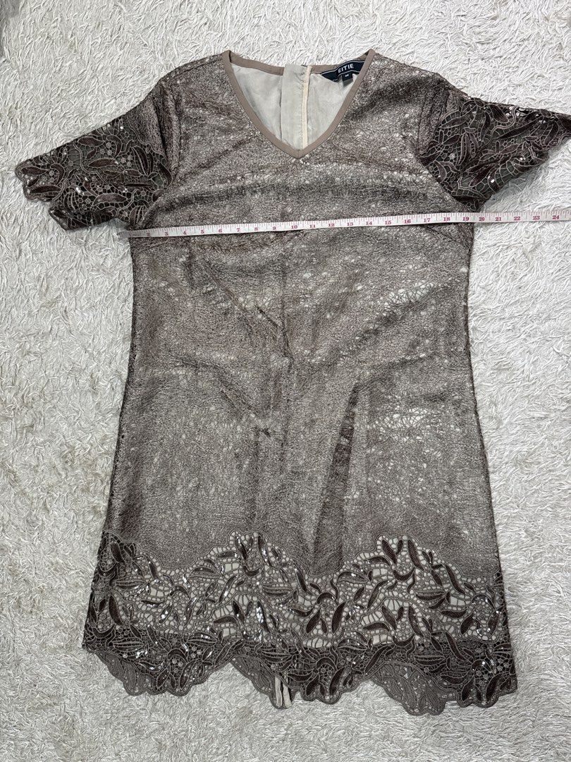 Brown Lace Dress (Category: Dresses) located in Quezon City. Submitted by dropdeadprices (Listing ID 1470849041, Image 3). Description: - Brand: EITIE - Size: 40 - Color: Gold - Material/Pattern: Beautiful textured lace overlay throughout - Design: Short sleeves, V-neckline with inner lining, and scalloped hem - Closure: Back neck zipper - 35- 39 inches length 19 inches pit to pit when laid flat.