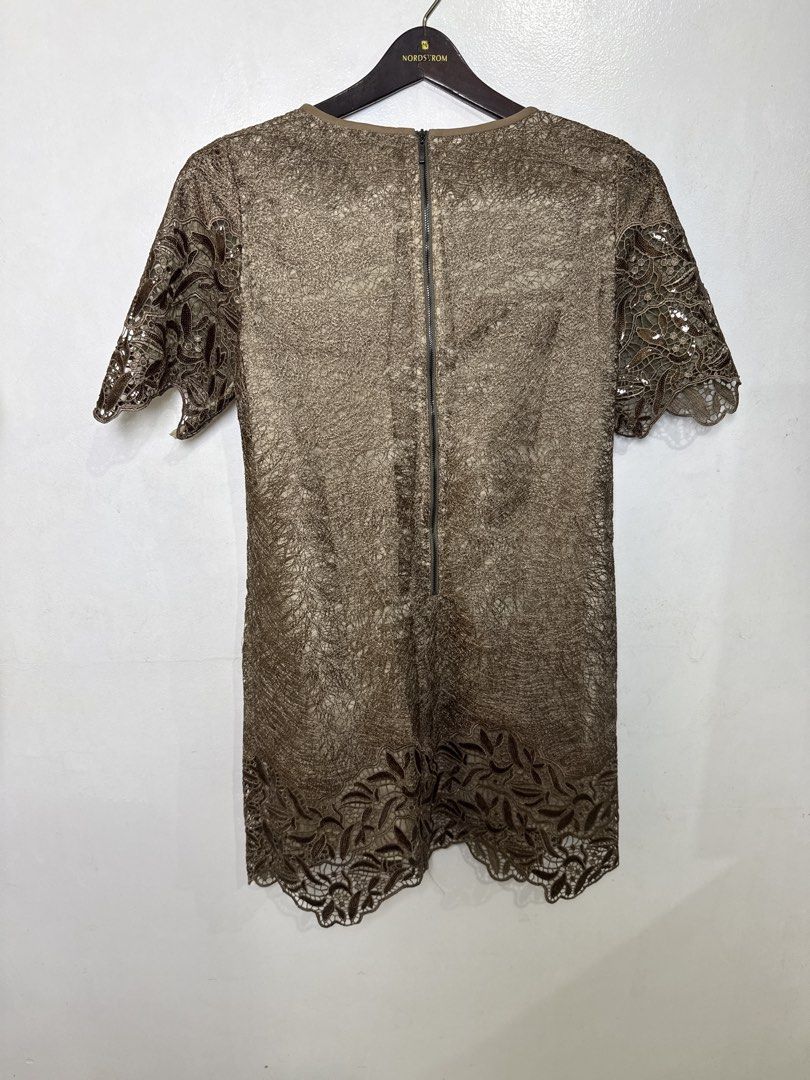 Brown Lace Dress (Category: Dresses) located in Quezon City. Submitted by dropdeadprices (Listing ID 1470849041, Image 2). Description: - Brand: EITIE - Size: 40 - Color: Gold - Material/Pattern: Beautiful textured lace overlay throughout - Design: Short sleeves, V-neckline with inner lining, and scalloped hem - Closure: Back neck zipper - 35- 39 inches length 19 inches pit to pit when laid flat.
