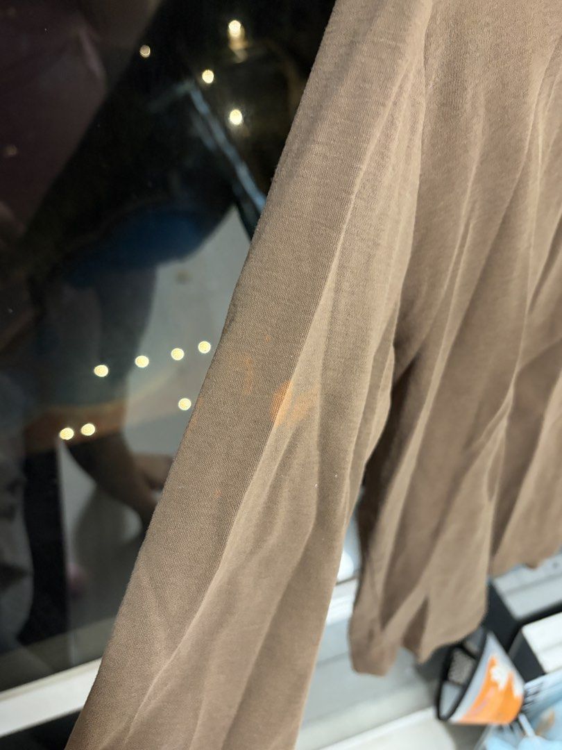 Brown Long Sleeve Mock Neck Top (like a heat tech) (Category: Longsleeves) located in Manila. Submitted by kylicee (Listing ID 1470899348, Image 2). Description: - Color: Brown - Style: Long sleeve mock neck top - Material: Soft, stretchy cotton - Condition: Good, but has a small orange bleach/stain spot on the right sleeve (check close-up photo) - Perfect versatile everyday basic.