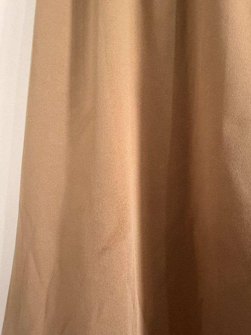 Brown maxi skirt with slit and drawstring waist (Category: Skirts) located in Marikina City. Submitted by _bananahanaa (Listing ID 1470801701, Image 3). Description: - Color: Versatile brown / neutral earth tone - Length: Midi to maxi - Fit: Elastic drawstring waist, easy pull-on style - Feature: Chic side slit for easy movement - Material: Soft and comfortable knit ribbed fabric - Condition: Clean and well cared for fits small-large.