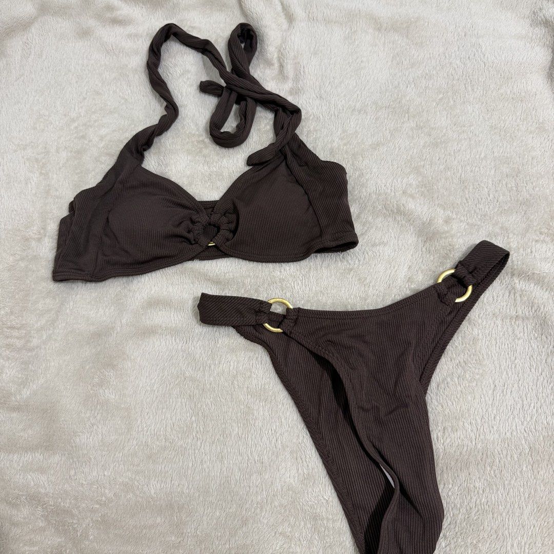 Brown Ribbed Bikini Set with Gold O-Rings (Category: Bikinis & Swimsuits) located in Manila. Submitted by kbm._. (Listing ID 1470929733, Image 1). Description: - Style: Brown ribbed two-piece swimsuit with halter neck and matching bottoms - Hardware: Elegant central gold ring link on top and gold-tone rings on both sides of the bottoms - Material: Textured fabric with great stretch for a comfortable fit - Condition: Excellent/Worn once for a quic