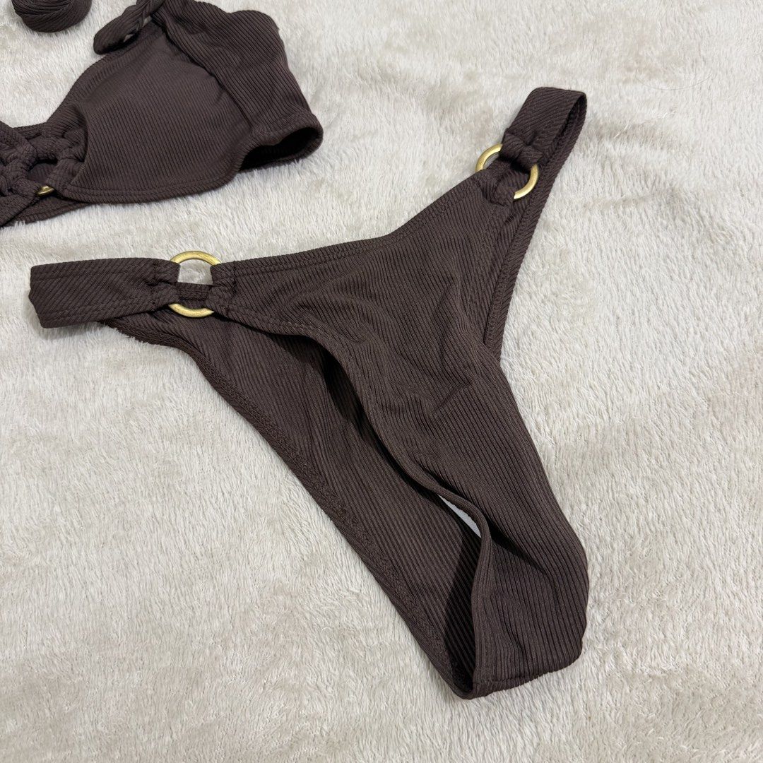 Brown Ribbed Bikini Set with Gold O-Rings (Category: Bikinis & Swimsuits) located in Manila. Submitted by kbm._. (Listing ID 1470929733, Image 3). Description: - Style: Brown ribbed two-piece swimsuit with halter neck and matching bottoms - Hardware: Elegant central gold ring link on top and gold-tone rings on both sides of the bottoms - Material: Textured fabric with great stretch for a comfortable fit - Condition: Excellent/Worn once for a quic