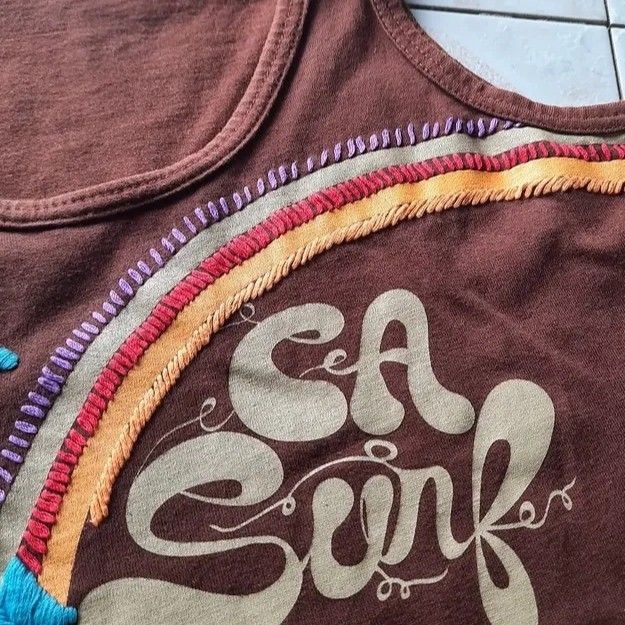 Brown summer tank top (Category: Sleeveless) located in Baguio. Submitted by jinriarchives (Listing ID 1470852486, Image 3). Description: ⤷ size: small ⤷ embroidered tropical palm ⤷ embroidered rainbow at the back.