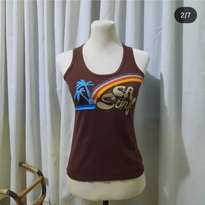 Brown summer tank top (Category: Sleeveless) located in Baguio. Submitted by jinriarchives (Listing ID 1470852486, Image 2). Description: ⤷ size: small ⤷ embroidered tropical palm ⤷ embroidered rainbow at the back.