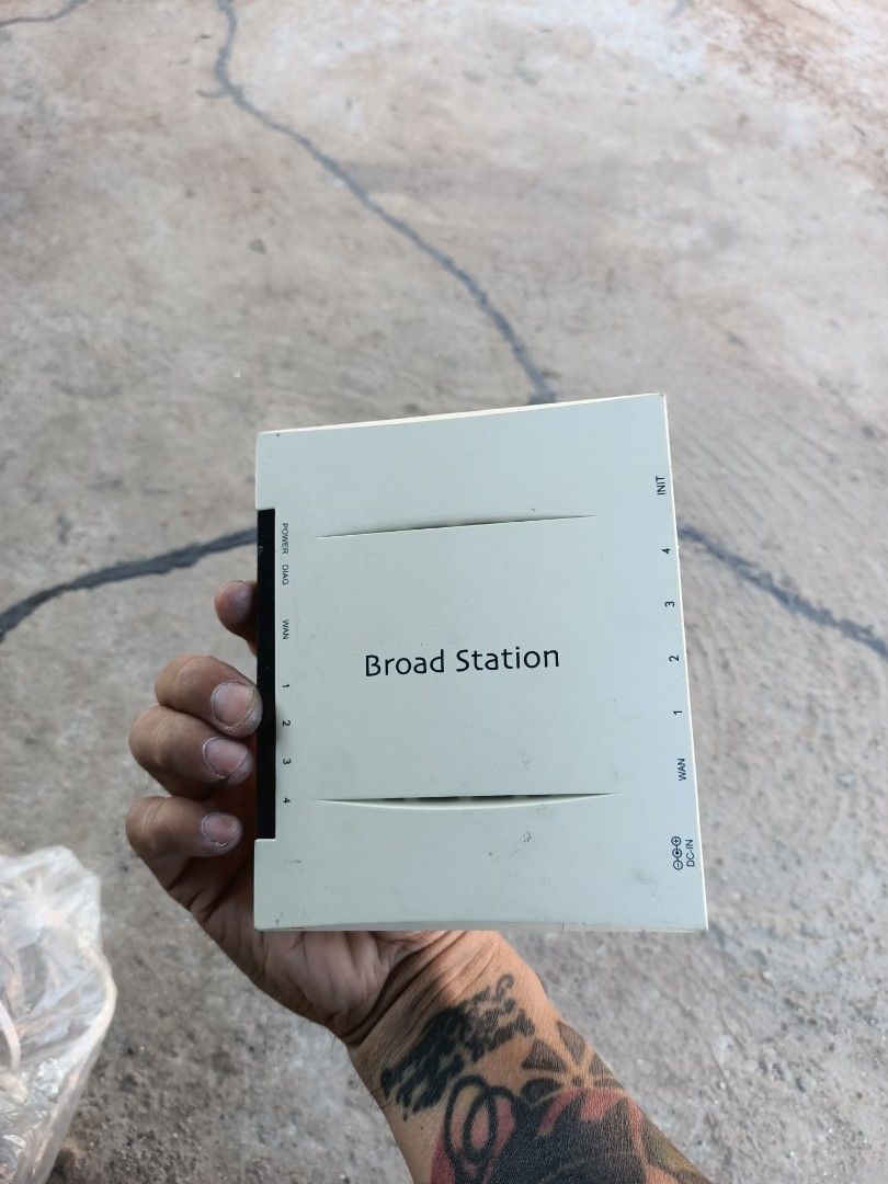 Buffalo Broad Station BBR-MG Broadband Router (Category: Networking) located in Taguig. Submitted by grandfish_55ab5c (Listing ID 1470895414, Image 3). Description: - Model: Buffalo Broad Station BBR-MG broadband router - Color: White casing - Ports: 1 WAN port and 4 LAN ports - Indicators: Front panel lights for power, diagnostic, WAN, and LAN 1-4 - Design: Compact desktop unit for easy internet sharing - Condition: Used with some surface marks 