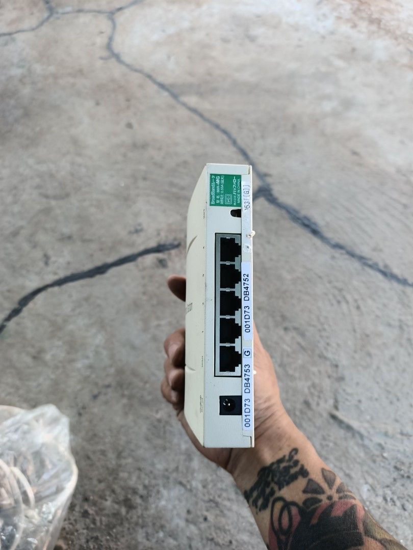 Buffalo Broad Station BBR-MG Broadband Router (Category: Networking) located in Taguig. Submitted by grandfish_55ab5c (Listing ID 1470895414, Image 2). Description: - Model: Buffalo Broad Station BBR-MG broadband router - Color: White casing - Ports: 1 WAN port and 4 LAN ports - Indicators: Front panel lights for power, diagnostic, WAN, and LAN 1-4 - Design: Compact desktop unit for easy internet sharing - Condition: Used with some surface marks 