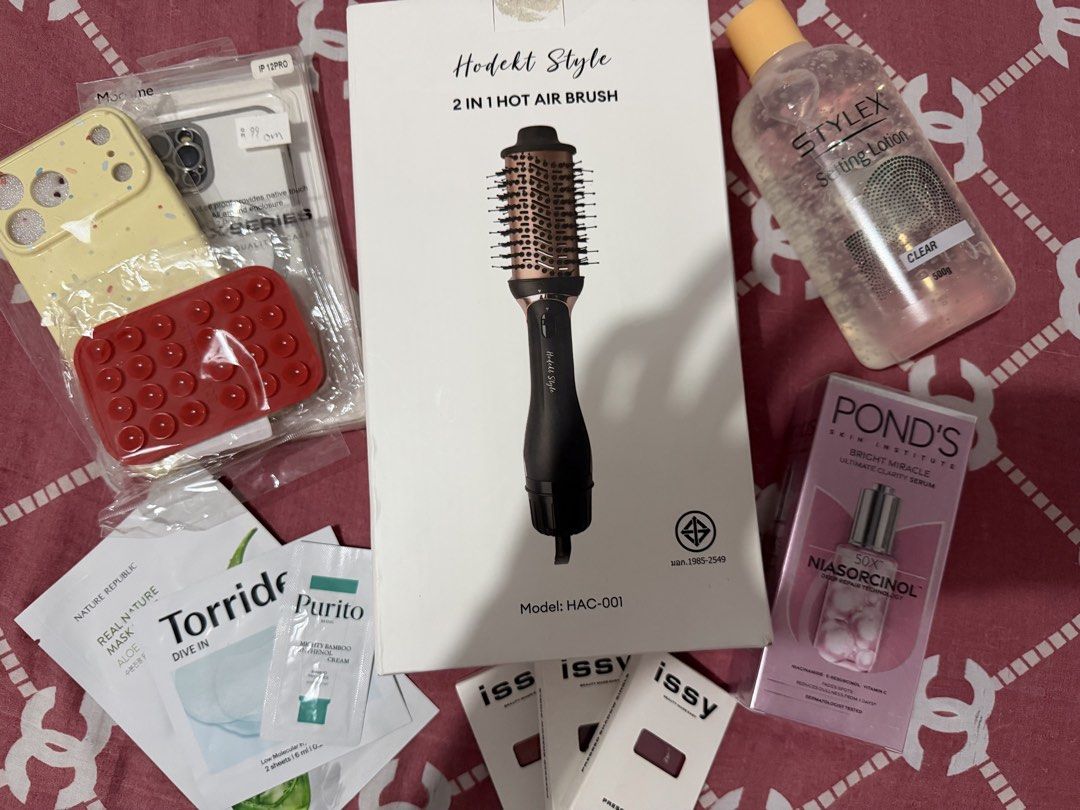 Bundle 1 (christmas gift) (Category: Hair) located in Cavite. Submitted by kai.iia (Listing ID 1470924911, Image 2). Description: 12 ITEMS OF PRODUCT FOR ONLY 999 - Hodekt 2 in 1 Hot Air Brush - Iphone 17 pro max case (yellow) - Iphone 12 pro case (clear) - Sunnies Suction Phone Holder (red) - Face Mask & Cream - Issy Eye Shadow (fever, aubergine, bordeaux) - Ponds Serum - Stylex Setting Lotion.
