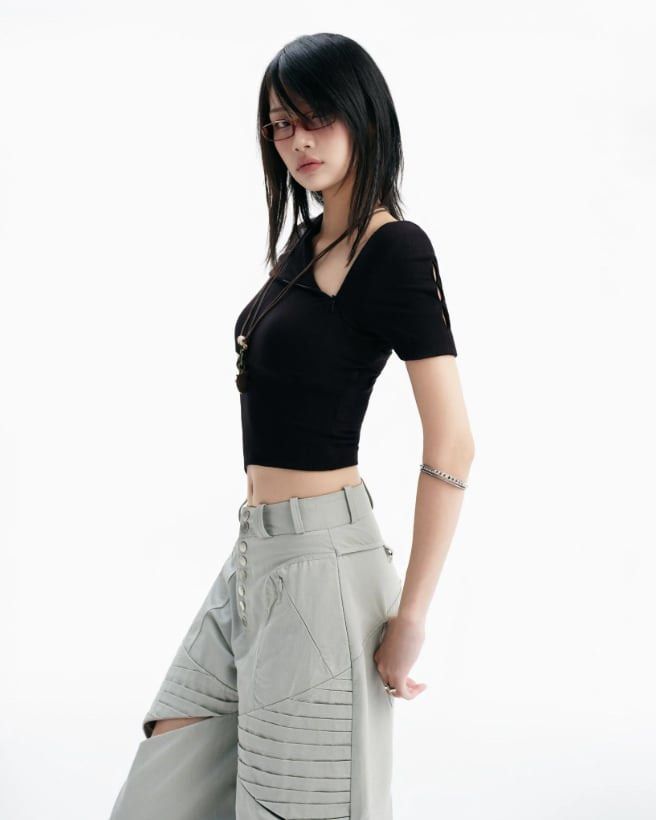 Bunnyhill Concept - Remi Top (Category: Sleeveless) located in Paranaque City. Submitted by amdrs (Listing ID 1470799437, Image 3). Description: - Color: Black - Style: Asymmetrical one-shoulder crop top with midriff cutouts and pointed front hem - Best fits S-M.