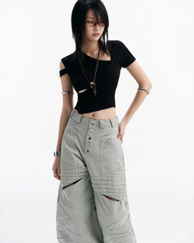 Bunnyhill Concept - Remi Top (Category: Sleeveless) located in Paranaque City. Submitted by amdrs (Listing ID 1470799437, Image 2). Description: - Color: Black - Style: Asymmetrical one-shoulder crop top with midriff cutouts and pointed front hem - Best fits S-M.