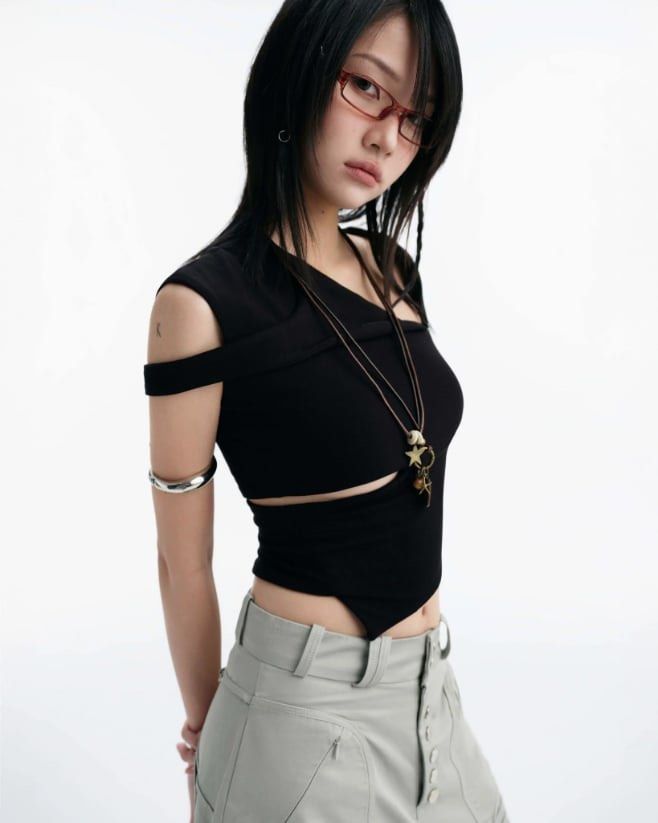 Bunnyhill Concept - Remi Top (Category: Sleeveless) located in Paranaque City. Submitted by amdrs (Listing ID 1470799437, Image 1). Description: - Color: Black - Style: Asymmetrical one-shoulder crop top with midriff cutouts and pointed front hem - Best fits S-M.