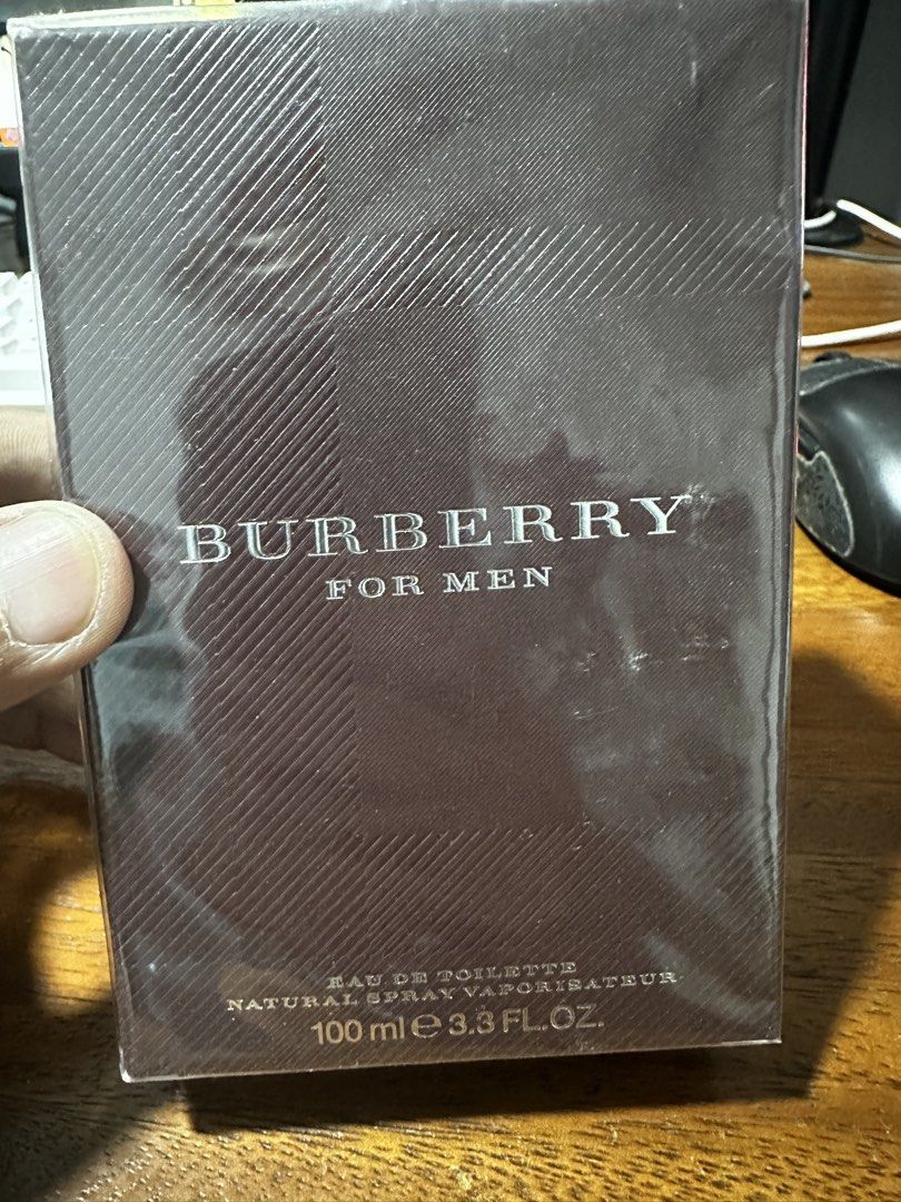 Burberry For Men Eau De Toilette 100ml (Category: Fragrance & Deodorants) located in Quezon City. Submitted by breakstuf50 (Listing ID 1470792228, Image 1). Description: - Brand: Burberry For Men - Type: Eau de Toilette (EDT) Spray - Size: 100 ml / 3.3 fl. oz. - Condition: Brand new, plastic wrap still sealed - Authenticity: Standard ingredient list, manufacturer info, and Coty distribution details printed on the back from the US padala.