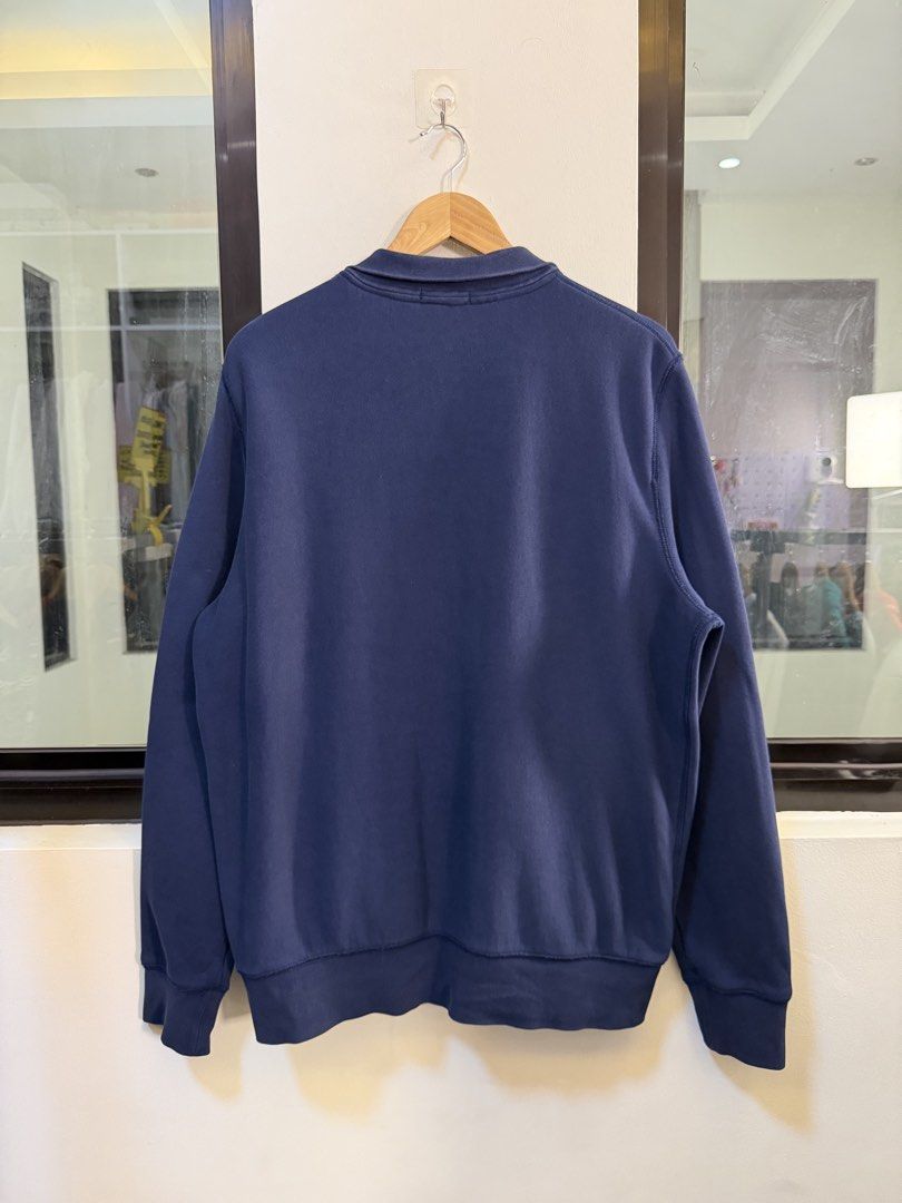 Burberry Full-Zip Track Jacket (Category: Coats, Jackets and Outerwear) located in Paranaque City. Submitted by preluxeshop_ph (Listing ID 1470817692, Image 3). Description: Brand: Burberry Brit •Style: Full-Zip Track Jacket / Sweatshirt •Color: Dark Navy Blue •Design Features: Full front zip closure with gold-tone hardware, stand-up collar, front welt pockets, ribbed cuffs and hem, and signature plaid check inner lining •Tag Size: Extra Large (X