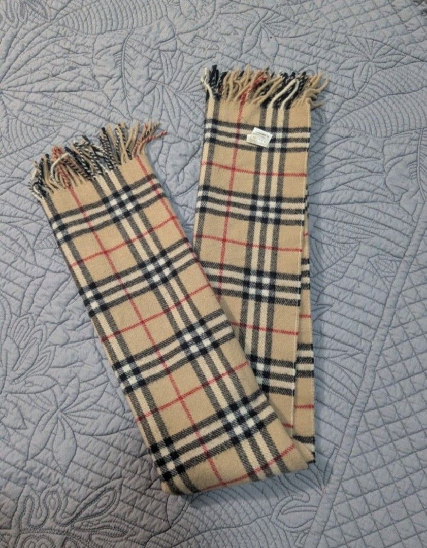 Burberry Nova Check Plaid Shawl (Category: Luxury Accessories) located in Quezon City. Submitted by nnncorner (Listing ID 1470877113, Image 2). Description: ​Original Burberry's Nova Check Plaid Classic Shawl in Camel Brown 100% New Wool 120cm x 65 cm 9/10 condition No any issues Rare Item and collection Original price 280$, you may check online din. 100% authentic and bought from Japan DRY CLEAN ONLY Selling : 3,000.