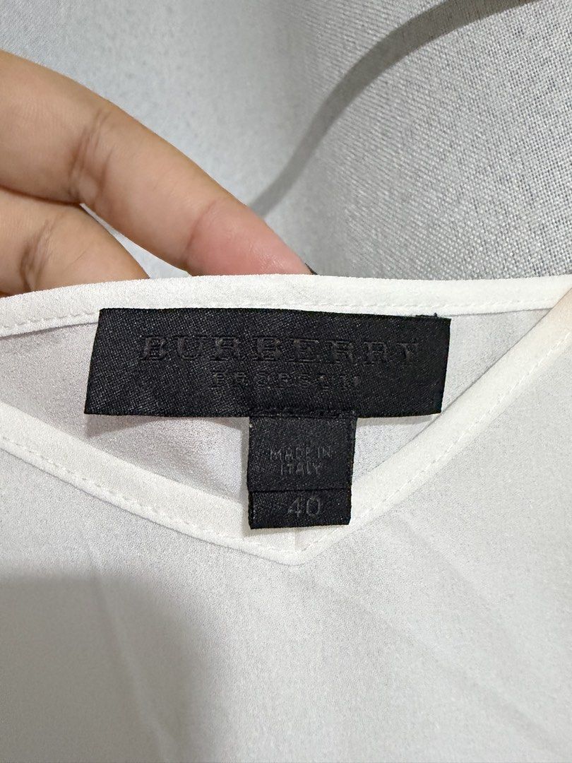 BURBERRY PRORSUM WHITE CHIFFON CAMI TOP (Category: Sleeveless) located in Iloilo. Submitted by thethriftopia (Listing ID 1470906440, Image 2). Description: EXCELLENT CONDITION 🖤 SIZE: S-M COLOR RATE: 10/10 DIMES: W 18 x L19 Wash and Wear Rewash if necessary Color may vary due to lighting Color rate indicated on description Disclaimer: Manage your expectations since this is a pre-loved item. Thank you so much. MOP GCASH and Bank Transfer SHIP VIA