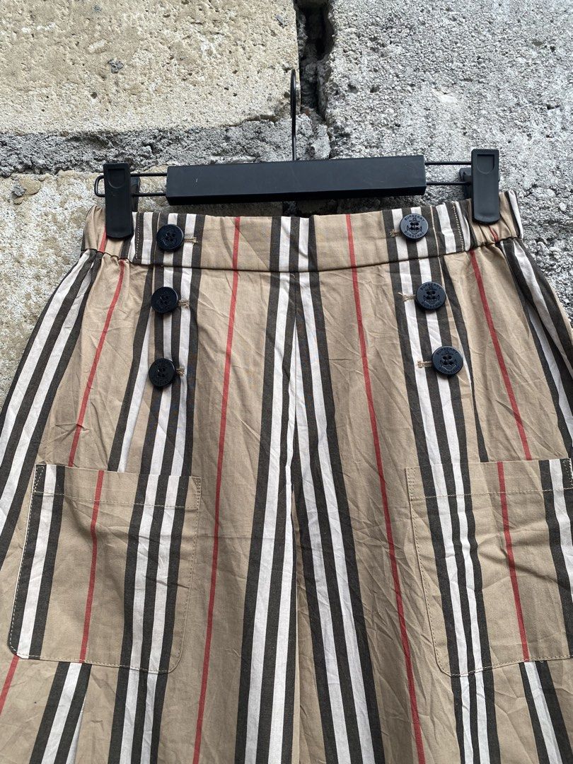 Burberry Striped Wide-Leg Pants (Category: Jeans) located in Candaba. Submitted by dejesus.bench17 (Listing ID 1470931727, Image 3). Description: - Brand: Burberry - Style: Wide-leg pants in classic beige with iconic striped pattern - Waistband: Elastic at the back for a comfortable fit - Closure: Front button with stylish anchor details - Pockets: Two functional front pockets - Condition: Clean, well-maintained, and gently used - Perfect for add