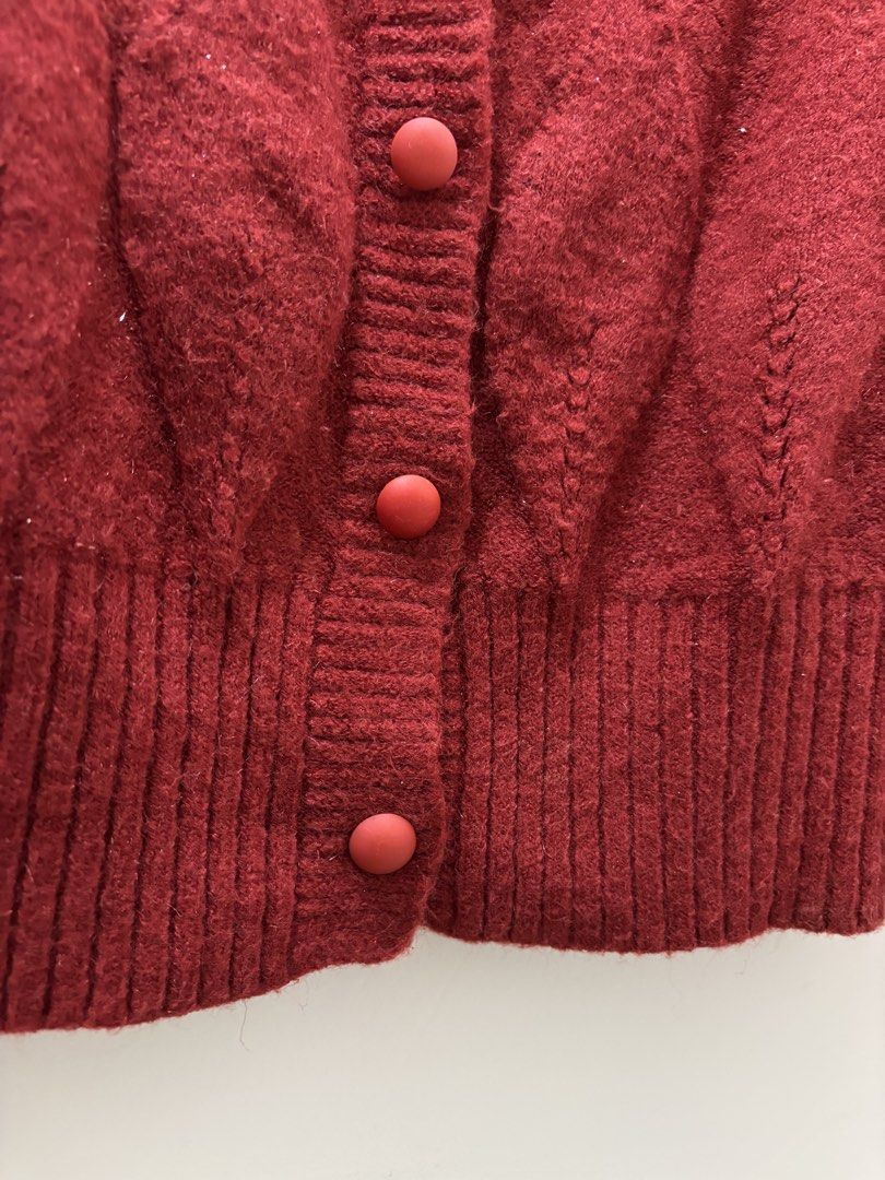 Burning Lotus Red Cable Knit Cardigan (Category: Coats, Jackets and Outerwear) located in Bacoor. Submitted by tummybeautyph (Listing ID 1470747091, Image 3). Description: - Brand: Burning Lotus - Color: Red - Material: Soft woolen texture - Design: Textured diamond pattern on front and back - Details: Round neckline, long sleeves, ribbed cuffs and hem, front button closure, with non transferrable glitters perfect for your Christmas parties - Con