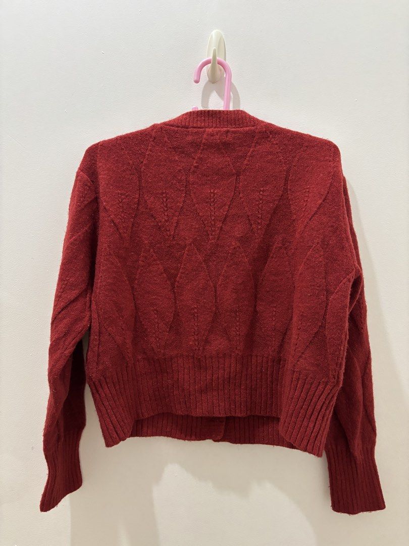 Burning Lotus Red Cable Knit Cardigan (Category: Coats, Jackets and Outerwear) located in Bacoor. Submitted by tummybeautyph (Listing ID 1470747091, Image 2). Description: - Brand: Burning Lotus - Color: Red - Material: Soft woolen texture - Design: Textured diamond pattern on front and back - Details: Round neckline, long sleeves, ribbed cuffs and hem, front button closure, with non transferrable glitters perfect for your Christmas parties - Con