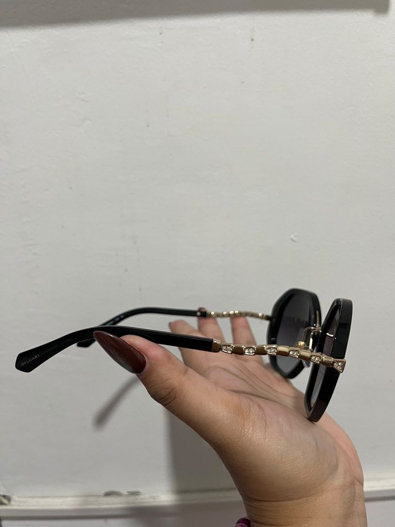 BVLGARI Sunglasses with Original Case and Pouch (Category: Sunglasses & Eyewear) located in Marilao. Submitted by ryuryuzj73716 (Listing ID 1470838455, Image 2). Description: - price slightly negotiable Brand: Authentic BVLGARI - Frame: Classic black with elegant gold-tone temple accents - Lenses: Gradient dark lenses - Inclusions: Original branded hard case, fabric dust pouch with drawstring, and BVLGARI logo box - Condition: Pristine, well-main