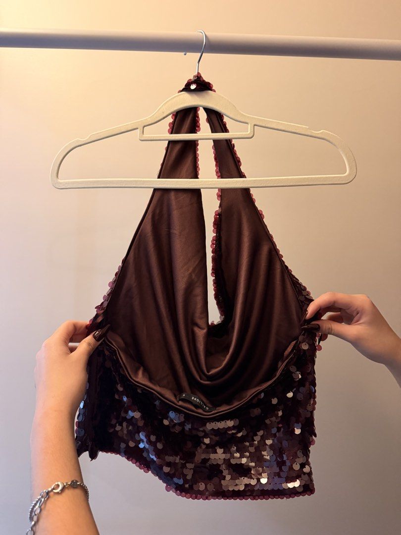 Calliope Maroon Sequin Halter Top Size S (Category: Sleeveless) located in Taguig. Submitted by rleilhoreine (Listing ID 1470770025, Image 2). Description: - Brand: Calliope - Size: Small - Color: Maroon - Design: Cowl neck, backless, tie-neck straps - Condition: Clean, no missing sequins - For: Parties and nights out.
