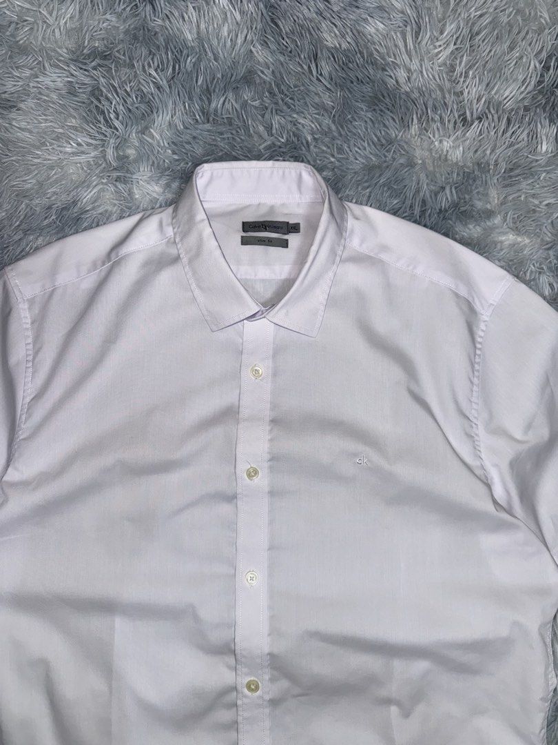 Calvin Klein Button Up Polo (Category: Formal Shirts) located in Taguig. Submitted by mrwickjohn67 (Listing ID 1470906005, Image 1). Description: No flaws Hangtag na lang kulang. Brand new condition, crispy tela 23x30.5.