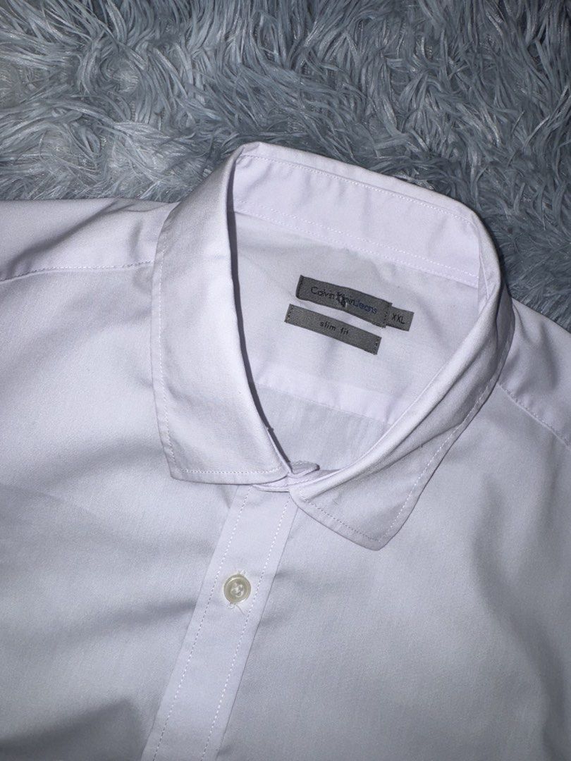 Calvin Klein Button Up Polo (Category: Formal Shirts) located in Taguig. Submitted by mrwickjohn67 (Listing ID 1470906005, Image 3). Description: No flaws Hangtag na lang kulang. Brand new condition, crispy tela 23x30.5.