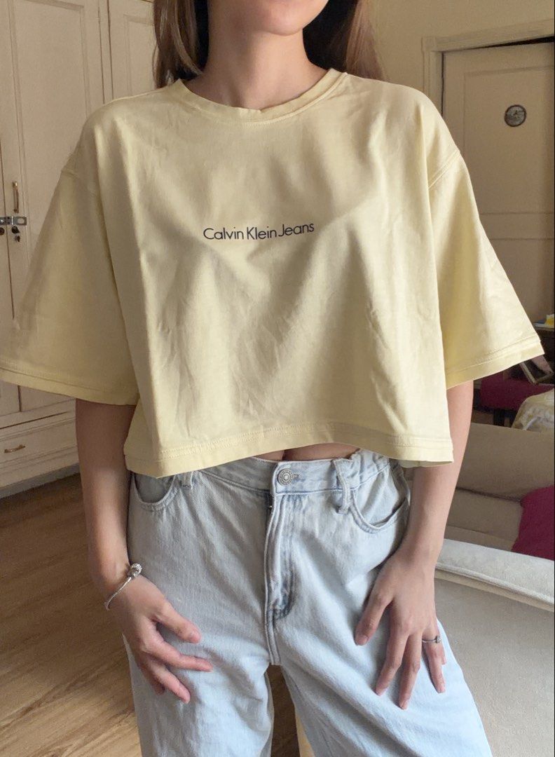 Calvin Klein Jeans Hanging Croptop (Category: Shirts) located in San Pedro. Submitted by nikkiabc.777 (Listing ID 1470752786, Image 2). Description: Calvin Klein Jean Hanging Top color: yellow size: Med; can be small to medium - thick fabric.