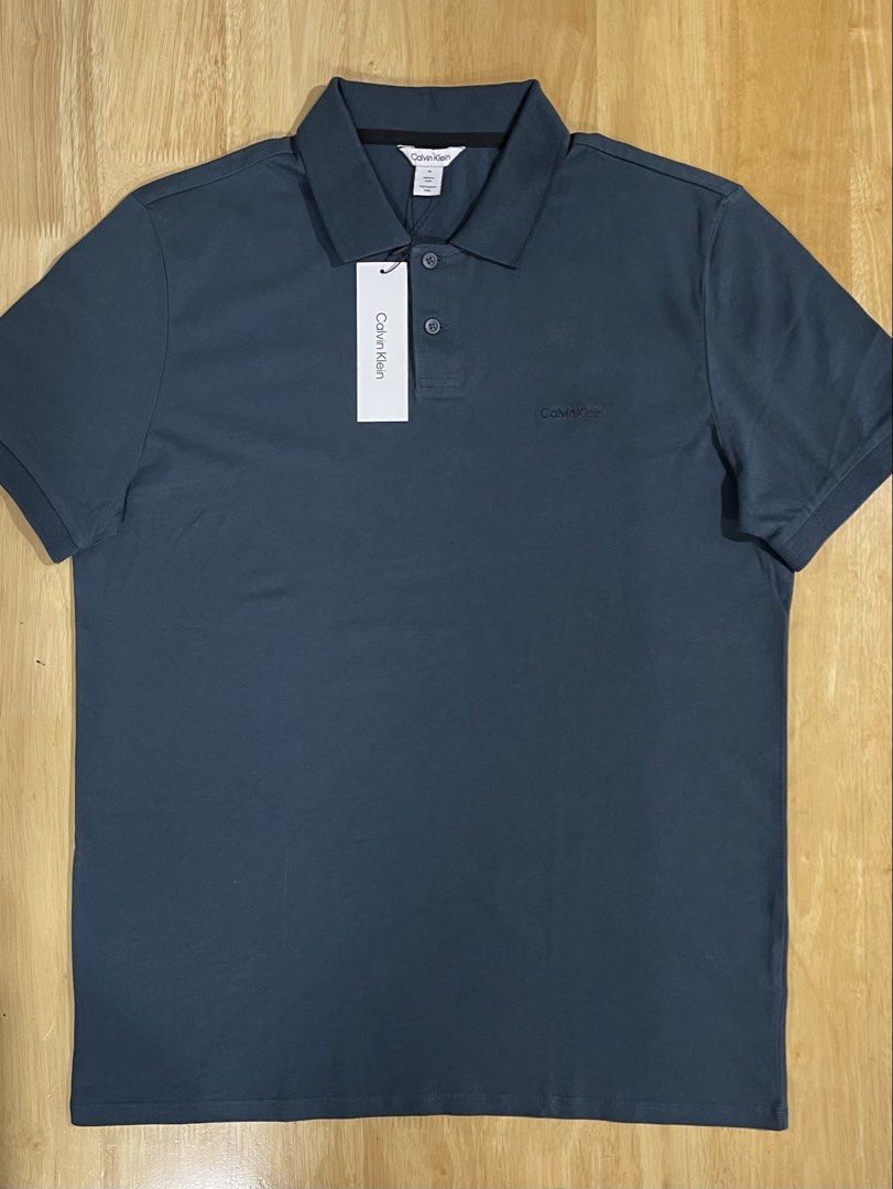 Calvin Klein Men's Polo Shirt Medium (Category: Tshirts & Polo Shirts ) located in Valenzuela. Submitted by adine000 (Listing ID 1470777688, Image 3). Description: Men's Polo Shirt✨ Regular fit Embroidered Logo Color: Navy Blue Medium W21" x L28" 💯Original | Brand new .