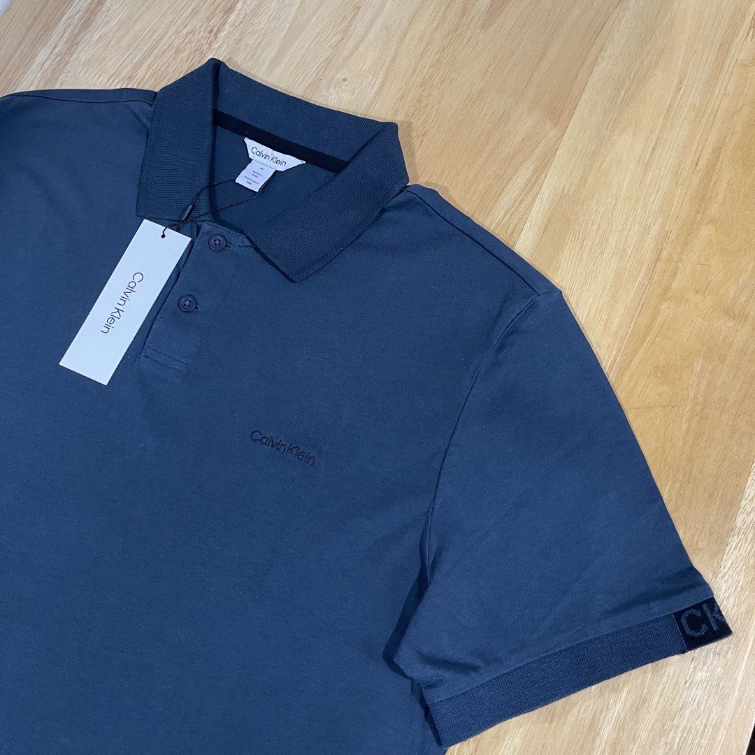Calvin Klein Men's Polo Shirt Medium (Category: Tshirts & Polo Shirts ) located in Valenzuela. Submitted by adine000 (Listing ID 1470777688, Image 2). Description: Men's Polo Shirt✨ Regular fit Embroidered Logo Color: Navy Blue Medium W21" x L28" 💯Original | Brand new .