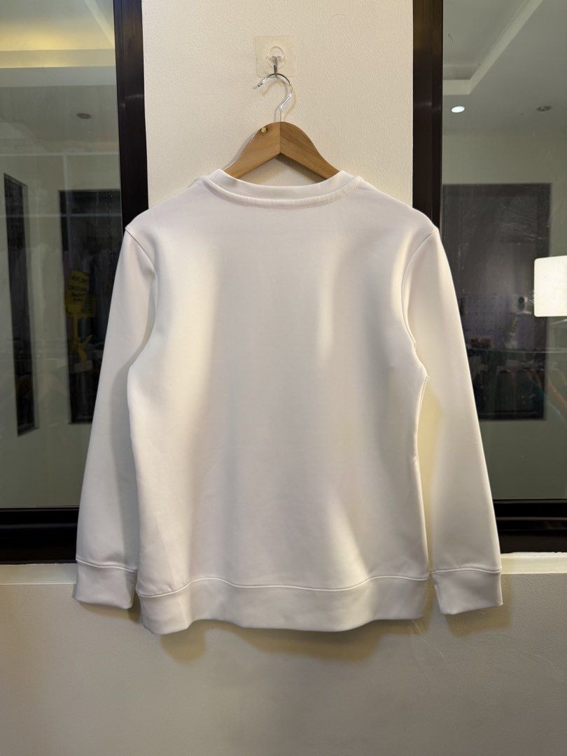 Calvin Klein Performance Long-Sleeve Crewneck Sweatshirt (Category: Coats, Jackets and Outerwear) located in Paranaque City. Submitted by preluxeshop_ph (Listing ID 1470814183, Image 3). Description: Brand: Calvin Klein Performance (Quick Dry line) •Style: Long-Sleeve Crewneck Sweatshirt / Pullover •Color: White with subtle pink inner neck taping •Design Features: Embossed tonal “Calvin” logo lettering across the chest, crew neckline, and ribbed 