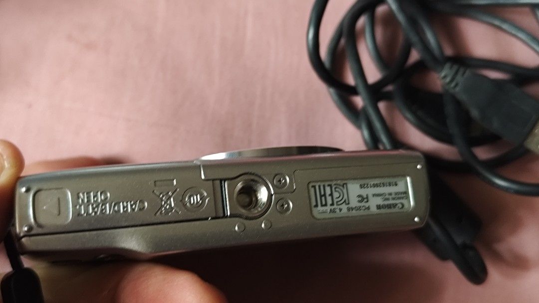 Canon IXUS 145 Digital Camera with USB Cable (Category: Cameras) located in Quezon City. Submitted by melizaak (Listing ID 1470921638, Image 3). Description: - Model: Canon IXUS 145 Digital Camera (Silver) - Condition: Powers on successfully with clear date and time setup menu - Lens: 8x optical zoom lens with 5.0-40mm focal range - Features: Built-in front flash and standard bottom tripod mount - Inclusions: Black USB cable with ferrite core fil