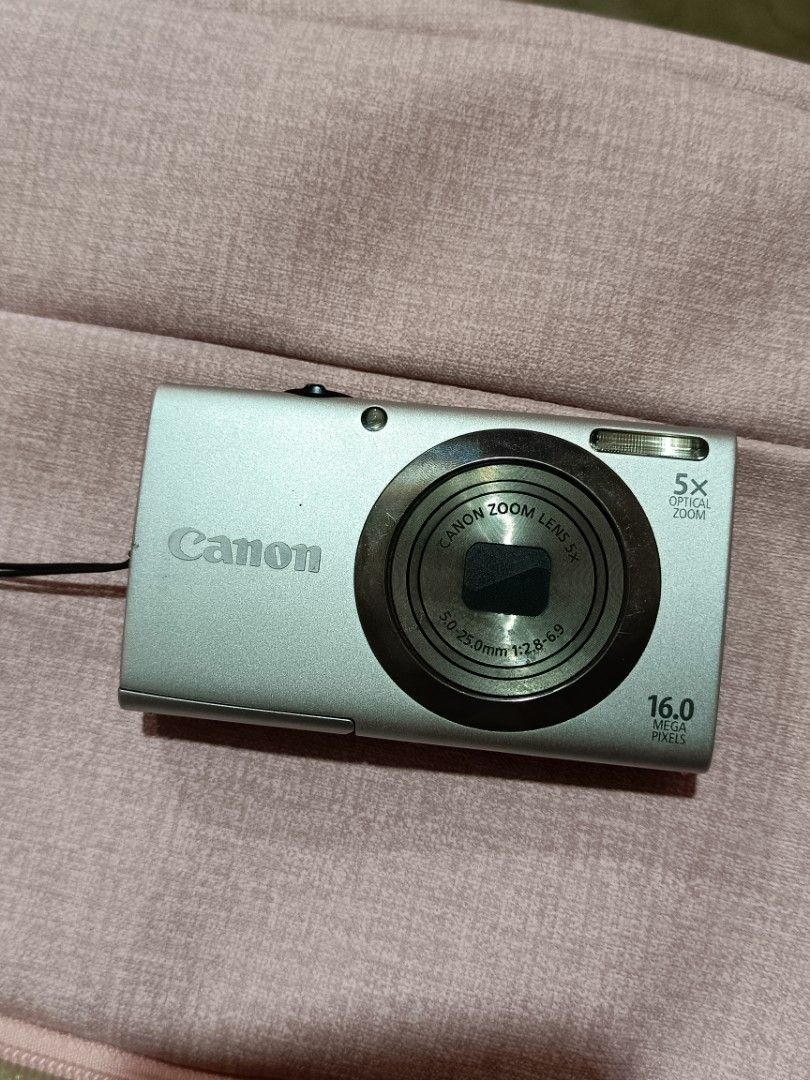 CANON POWERSHOT A2300 DIGITAL CAMERA DIGICAM (Category: Cameras) located in Manila. Submitted by jade_snap (Listing ID 1470830577, Image 1). Description: ✧⁠* CANON POWERSHOT A2300 - crisp outputs ♡ ₱4,299 READY TO USE lcd burn (doesn't affect the output and functionality) 🩰Specs: *.' 16.1 MP *.' 4x optical zoom *.' ISO 100 to 3200 *.' CCD sensor 🎞️ Condition: ७९ all buttons are working, zoom, and flash ७९ body condition: 9/10 ७९ w/ port cover �