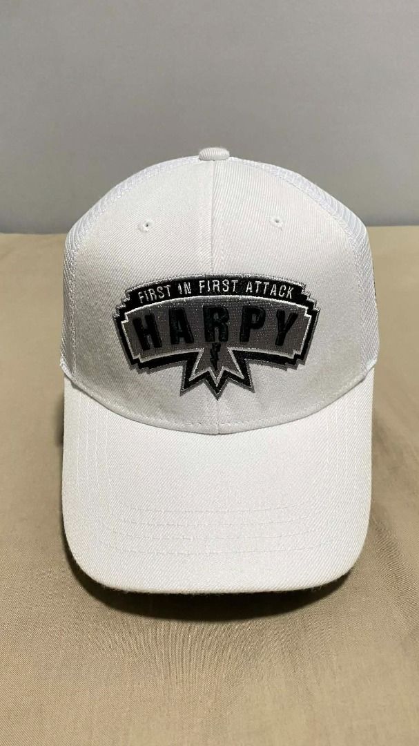 CapBoy Harpy 288SQ White Trucker Cap (Category: Caps & Hats) located in Manila. Submitted by hellmagevtg (Listing ID 1470800346, Image 1). Description: - Brand: CapBoy (Made in Korea) - Style: White trucker cap with adjustable strap closure - Design details: 'Harpy First in First Attack' embroidered patch on front - Accents: Eagle emblem on side and '288SQ' stitched on back - Condition: Clean interior with original branded tag intact.