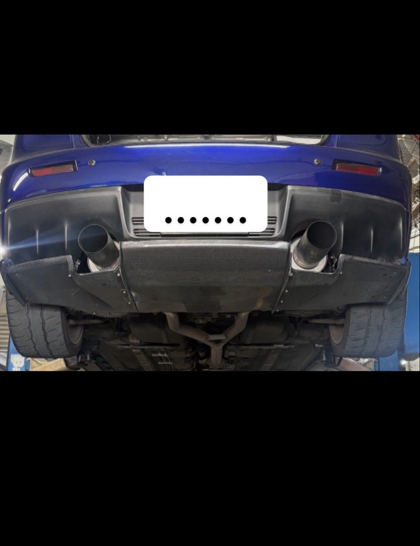 Carbon fiber rear diffuser (Category: Bodykits & Styling) located in Singapore. Submitted by driver66754 (Listing ID 1470857708, Image 2). Description: Selling my used carbon fibre diffuser. Includes brackets (custom-made brackets). Can recommend a workshop to customise brackets to suit your car. One bottom fin on the left side is broken, but it is not visible once the diffuser is installed. Used condition. Please refer to photos for actual condi