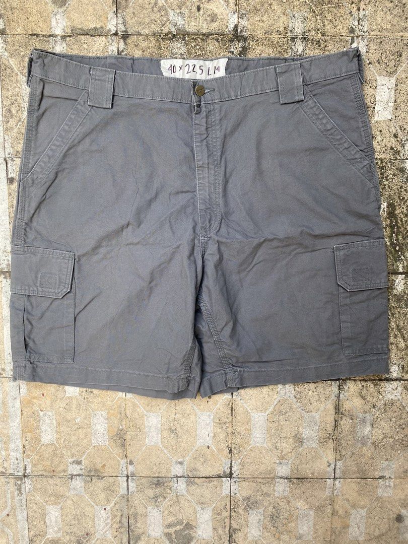 Carhartt Cargo Shorts Grey Size 40 (Category: Shorts) located in Imus. Submitted by frootiloots4103 (Listing ID 1470768344, Image 1). Description: - Brand: Carhartt - Color: Grey - Material: Sturdy canvas cotton - Size: 40 waist - Closure: Button fly - Pockets: Multiple side utility pockets and rear pockets - Details: Features iconic Carhartt logo patch on rear pocket - Condition/Use: Great for workwear or everyday casual use OPEN FOR NEGO (best 