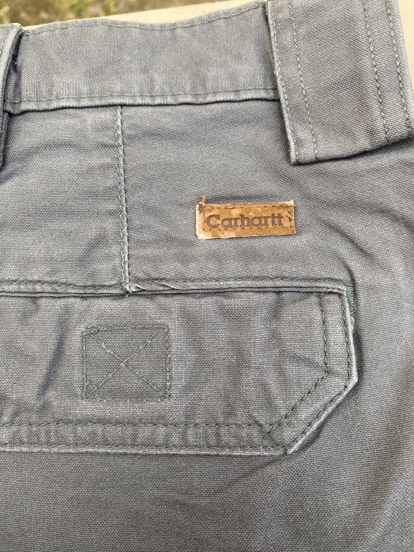 Carhartt Cargo Shorts Grey Size 40 (Category: Shorts) located in Imus. Submitted by frootiloots4103 (Listing ID 1470768344, Image 3). Description: - Brand: Carhartt - Color: Grey - Material: Sturdy canvas cotton - Size: 40 waist - Closure: Button fly - Pockets: Multiple side utility pockets and rear pockets - Details: Features iconic Carhartt logo patch on rear pocket - Condition/Use: Great for workwear or everyday casual use OPEN FOR NEGO (best 