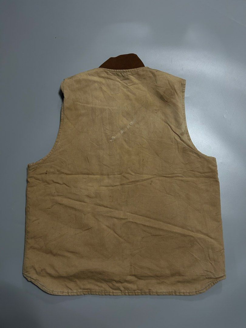 Carhartt VO1 BRN Vest (authentic) (Category: Coats, Jackets and Outerwear) located in Trece Martires City. Submitted by flip_flips (Listing ID 1470895209, Image 2). Description: Carhartt VO1 BRN Vest (authentic) -Dimes: 25 width 29 length -Good condition -9/10 color rate -Issue: stains dot, minor dot tatterings on back part.