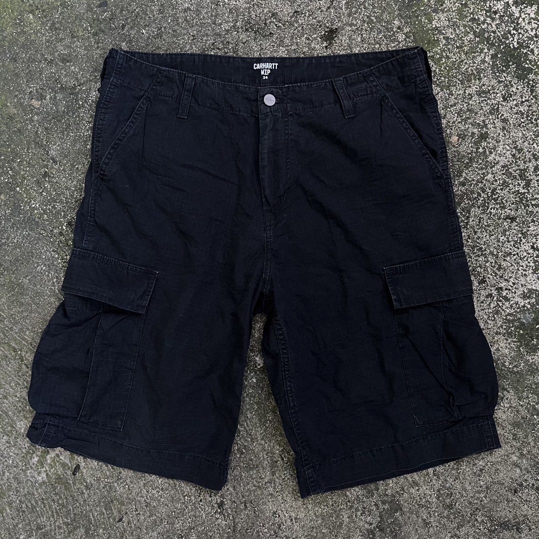 Carhartt WIP Regular Cargo Shorts Black Size 34 (Category: Shorts) located in Davao. Submitted by streetsight (Listing ID 1470824020, Image 3). Description: - Brand: Carhartt WIP - Style: Regular cargo shorts - Color: Black - Size: 34 waist - Material: Durable cotton blend ripstop fabric - Features: Multiple side and back utility pockets, button fly closure, and iconic woven square label - Condition: Great daily wear staple.
