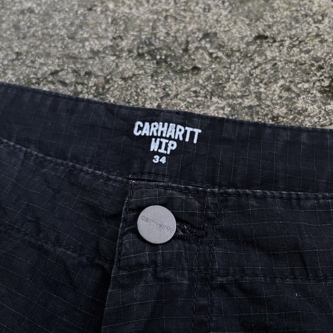 Carhartt WIP Regular Cargo Shorts Black Size 34 (Category: Shorts) located in Davao. Submitted by streetsight (Listing ID 1470824020, Image 2). Description: - Brand: Carhartt WIP - Style: Regular cargo shorts - Color: Black - Size: 34 waist - Material: Durable cotton blend ripstop fabric - Features: Multiple side and back utility pockets, button fly closure, and iconic woven square label - Condition: Great daily wear staple.
