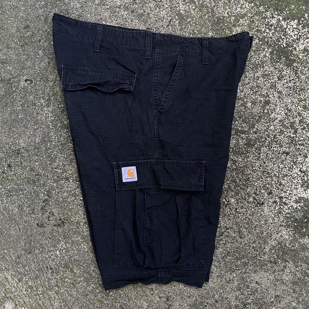 Carhartt WIP Regular Cargo Shorts Black Size 34 (Category: Shorts) located in Davao. Submitted by streetsight (Listing ID 1470824020, Image 1). Description: - Brand: Carhartt WIP - Style: Regular cargo shorts - Color: Black - Size: 34 waist - Material: Durable cotton blend ripstop fabric - Features: Multiple side and back utility pockets, button fly closure, and iconic woven square label - Condition: Great daily wear staple.