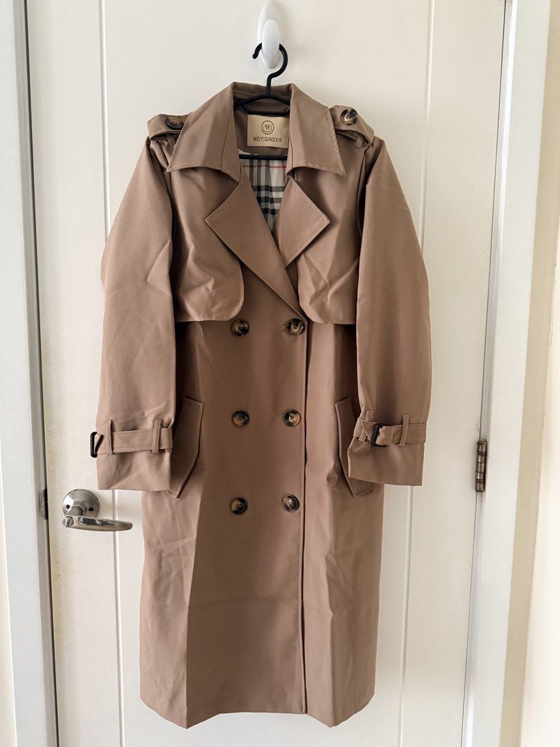 Carine Classic Double-Breasted Trench Coat (Category: Coats, Jackets and Outerwear) located in Pasig City. Submitted by vdejesus (Listing ID 1470844425, Image 1). Description: 🧥 Classic Double-Breasted Long Trench Coat in Khaki Camel (Plaid Lining) Used once during travel. Tag / Brand: WEIYIQINGXIN (Carine on Tiktok) Color: Classic Khaki / Warm Camel Tan Size: Large (L) (Fits Medium to Large comfortably for easy layering over sweaters).