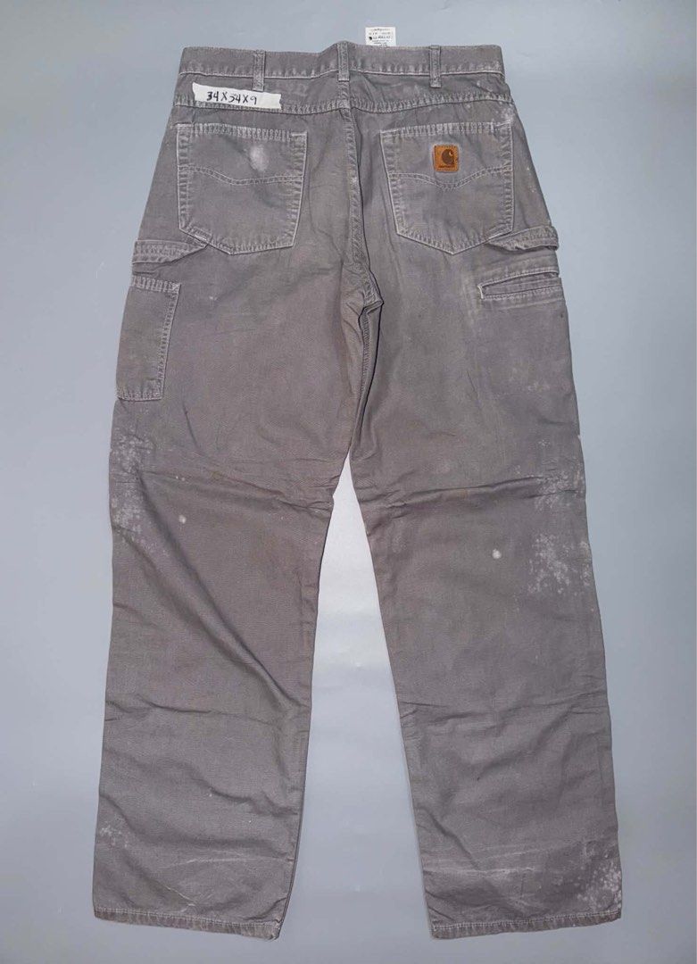 4 pcs carhartt pants (Category: Jeans) located in Santa Rosa. Submitted by n.vallermosa (Listing ID 1470918123, Image 1). Description: - Lot of 4 Carhartt work pants and jeans - Colors: Grey, beige, and light wash denim - Durable heavy-duty canvas and denim construction - Includes utility pockets and hammer loops on select styles - Condition: Visible wear, fading, distressing, stains, and frayed hems throughout - Sold as a bundle pack 6000 obo.