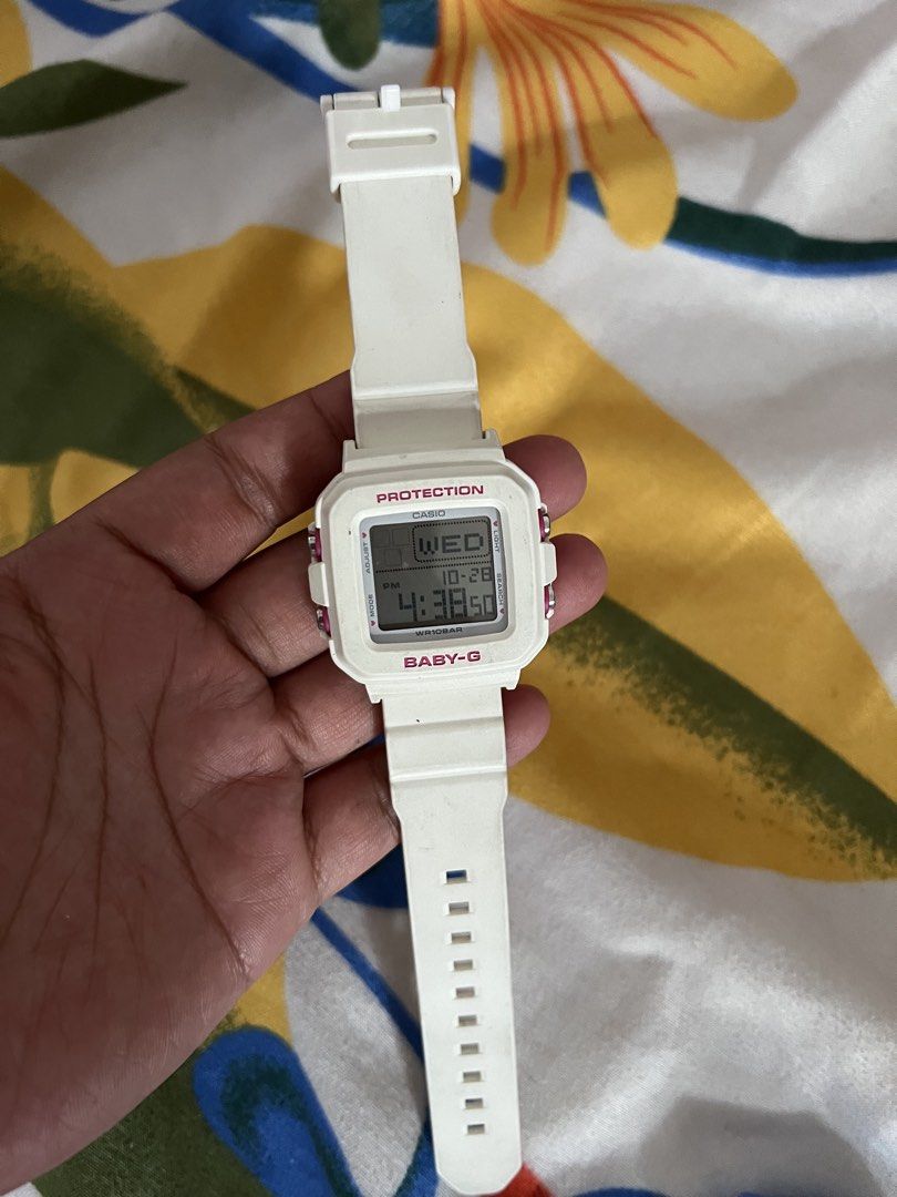 Casio Baby-G Protection Digital Watch White (Category: Women's Watches) located in Manila. Submitted by roxanne.23 (Listing ID 1470808732, Image 1). Description: - Authentic Casio Baby-G digital watch in clean white - Cute pink accents on the bezel and push buttons - Square digital display showing time, day, and date - Comfortable and durable rubber strap with adjustable buckle - Water-resistant up to 10 bars, great for daily use - Battery-powere