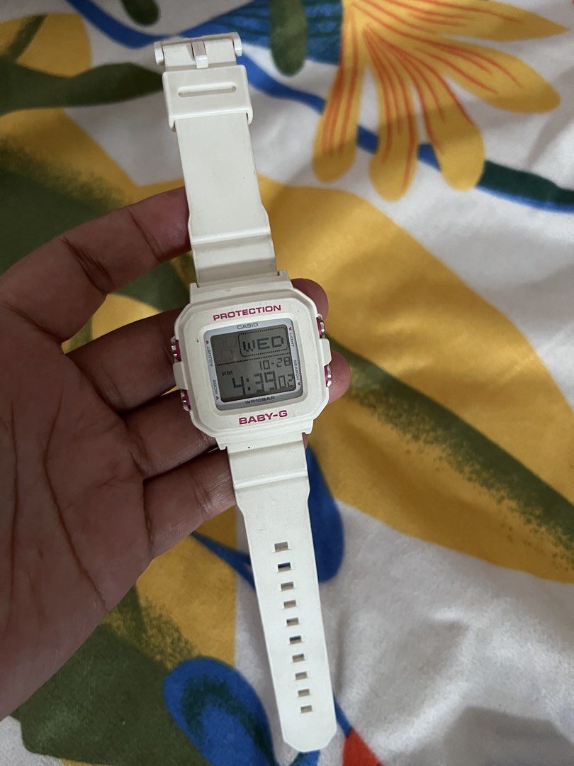 Casio Baby-G Protection Digital Watch White (Category: Women's Watches) located in Manila. Submitted by roxanne.23 (Listing ID 1470808732, Image 2). Description: - Authentic Casio Baby-G digital watch in clean white - Cute pink accents on the bezel and push buttons - Square digital display showing time, day, and date - Comfortable and durable rubber strap with adjustable buckle - Water-resistant up to 10 bars, great for daily use - Battery-powere