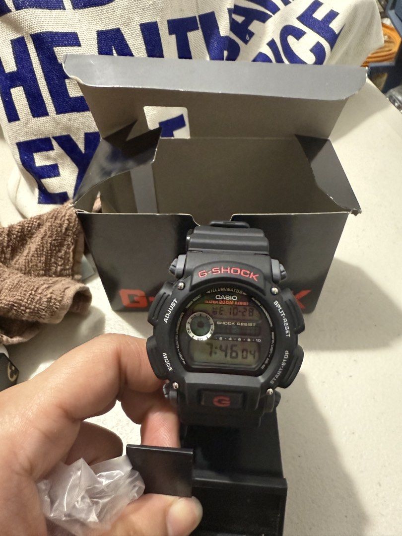 Casio G-Shock DW-9052-1VCG Watch (Category: Men's Watches) located in Manila. Submitted by sjsy103006 (Listing ID 1470852163, Image 1). Description: - Model: Casio G-Shock DW-9052-1VCG (Black with striking red lettering) - Durability: Iconic G-Shock shock resistance with 200m water resistance - Strap: Comfortable black resin strap - Inclusions: Complete set with original obox, display stand, and manual - Condition: Excellent, ready for daily wear