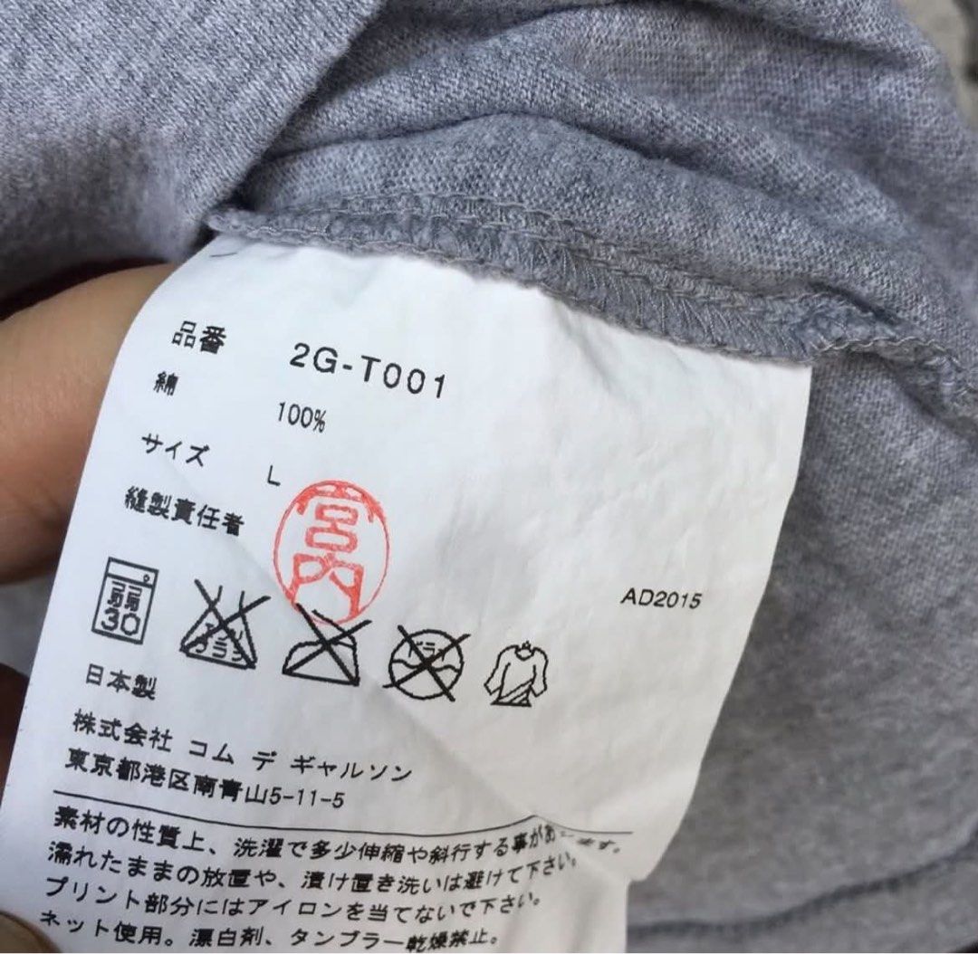 CDG pockets tee (Category: Shirts) located in Caloocan City. Submitted by landcruiser76__ (Listing ID 1470775149, Image 3). Description: - Material: 100% Cotton - Origin: Made in Japan (AD2015) - Color: Grey - Details: Unique front graphic print, branding near hem, crew neck, short sleeves - Condition: Tag and care labels intact Size : Large Dimensions : Length 26.5” Width 20”.