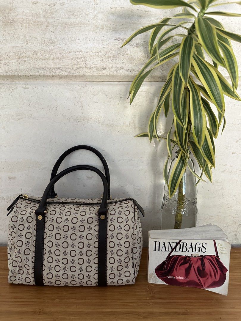 Celine Monogram Canvas Barrel Bag (Category: Luxury Bags & Wallets) located in Muntinlupa City. Submitted by belica (Listing ID 1470852584, Image 3). Description: - Brand: Celine - Style: Vintage Barrel Bag - Material: Cream and brown monogram canvas with dark brown leather handles and side straps - Hardware: Gold-tone zippers and rings - Closure: Top zip closure - Condition: Clean exterior with a structured shape.