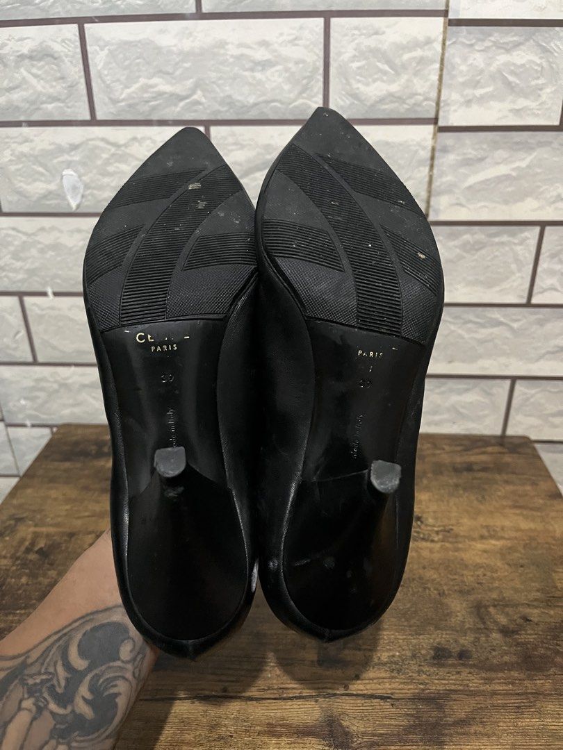 Celine Paris Black Leather Pointed Toe Heels Size 39 (Category: Heels) located in Manila. Submitted by kuya_erick62 (Listing ID 1470760989, Image 3). Description: - Brand: Celine Paris (Made in Italy) - Style: Slip-on pumps with pointed toes, deep V-cut front, and curved heels - Color: Classic Black - Material: Genuine Leather - Size: EU 39 - Condition: Pre-owned, soles show visible wear from previous use - Perfect timeless luxury piece to elevat