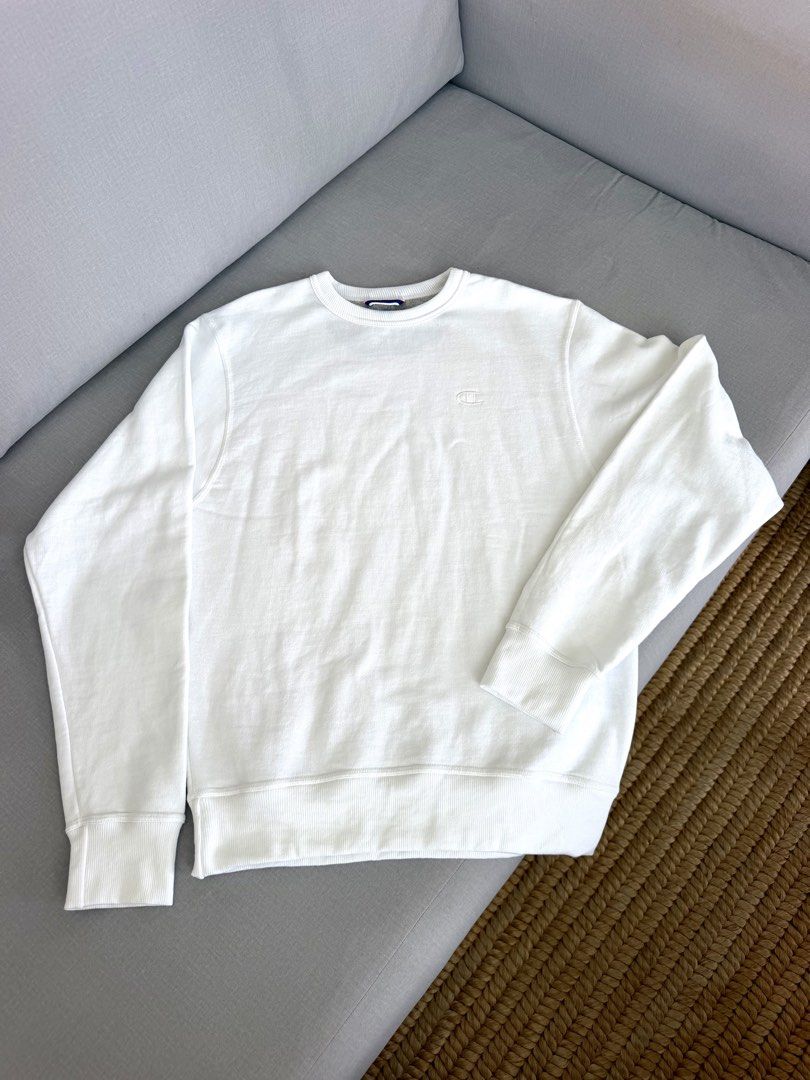 Champion Authentic Athleticwear White Sweatshirt (Category: Coats, Jackets and Outerwear) located in Lipa City. Submitted by pauline0303 (Listing ID 1470806322, Image 1). Description: - Authentic white Champion crewneck sweatshirt - Size: Small (USA) / Large (Asia) - Classic embroidered logo on the chest - Signature small patch on the left sleeve - Ribbed collar, cuffs, and hem for a snug fit - Clean white fabric, great for everyday layering.