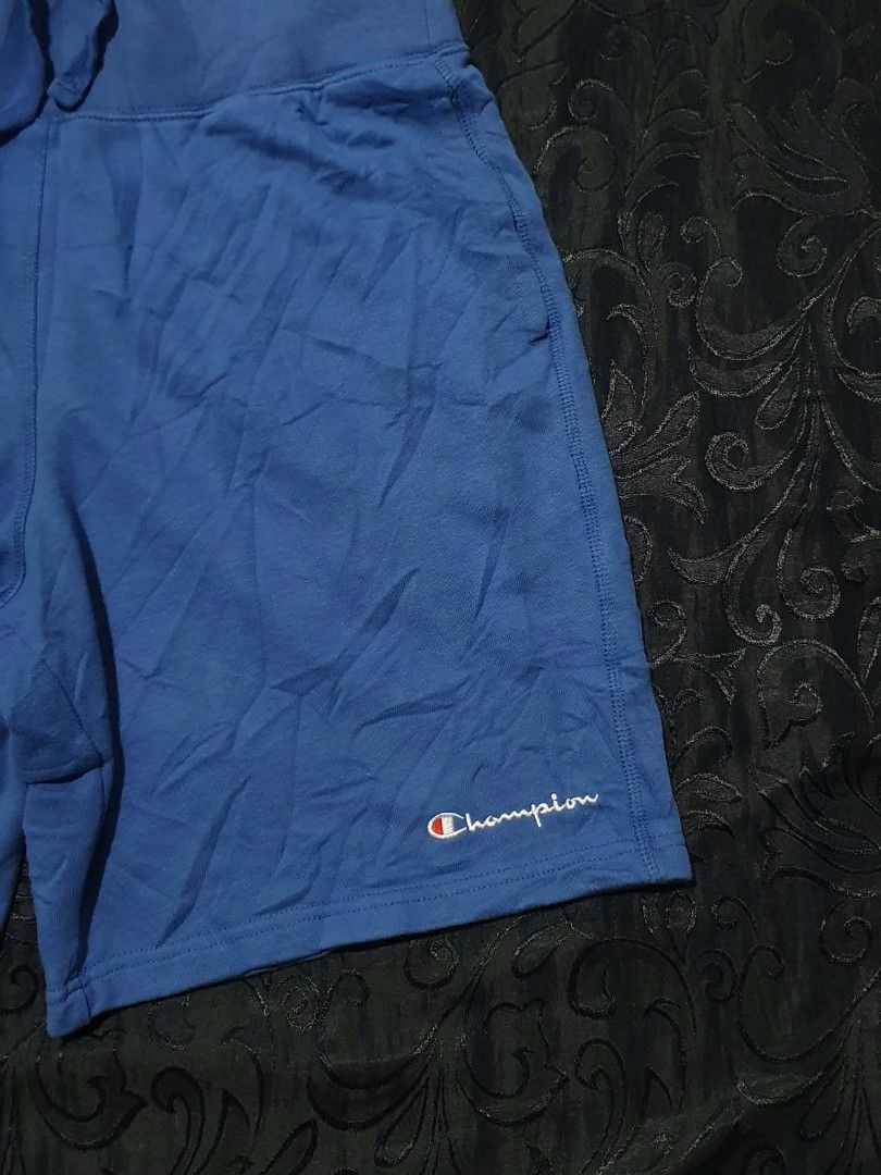 Champion Blue Sweatshorts (Category: Shorts) located in Manila. Submitted by tristan12_13 (Listing ID 1470890725, Image 2). Description: - Brand: Champion - Item: Blue Sweatshorts - Size: Medium - Dimensions: Waist- 30-34 with adjustable lace, Length- 19, Hem- 12 - Details: Embroidered script logo near hem, single right back pocket - Best for: Casual lounging or workouts.