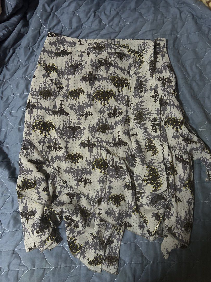 Chandelier patterned grey wrap ruffle skirt (Category: Skirts) located in Manila. Submitted by ardol (Listing ID 1470780821, Image 1). Description: 28-29 waistline - Color & Pattern: Grey & dark purplwwith repeating chandelier and polka dot print - Design: Wrap-style with a flat waistband and trendy ruffled asymmetric hem - Fabric: Lightweight and flowy, very comfortable to wear - Styling Tip: Super easy to match with a simple black or white top.